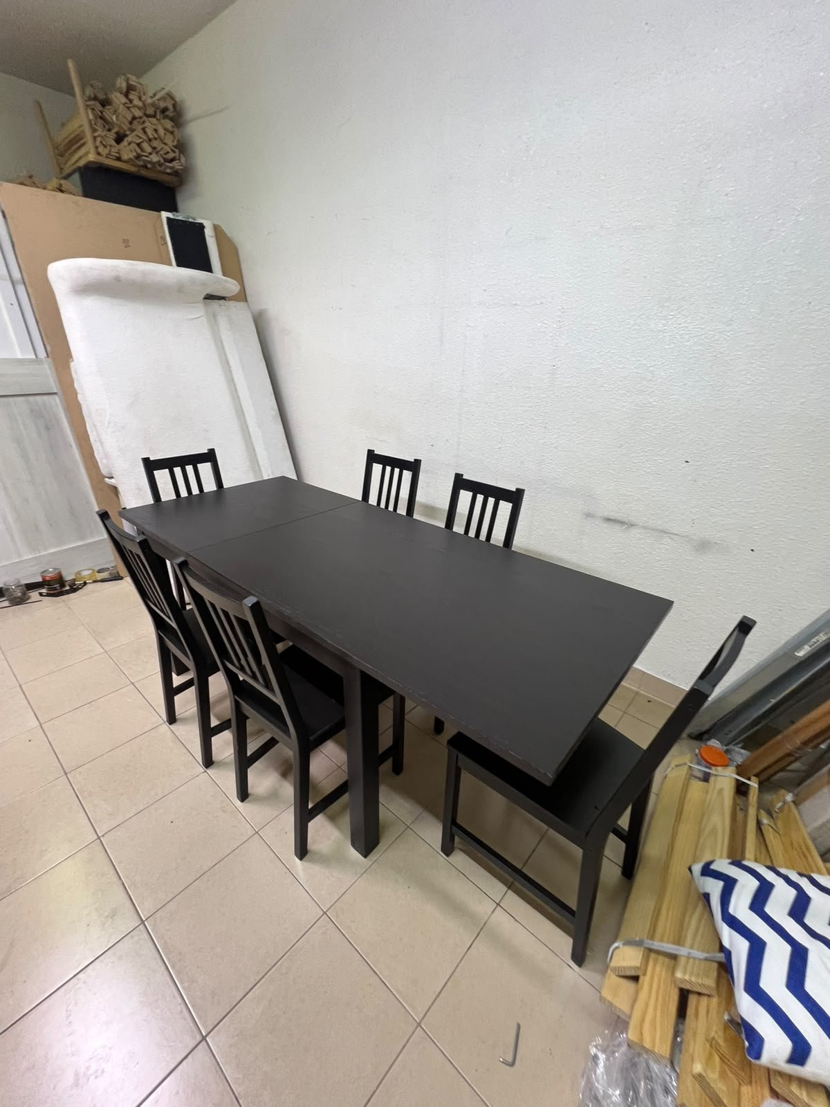 A dark solid wood dining table with matching slat-back chairs, featuring the design of the "Nordviken" collection from IKEA. - Image 7