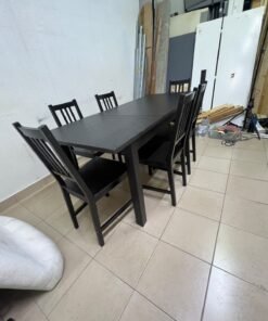 A dark solid wood dining table with matching slat-back chairs, featuring the design of the "Nordviken" collection from IKEA. - Image 9