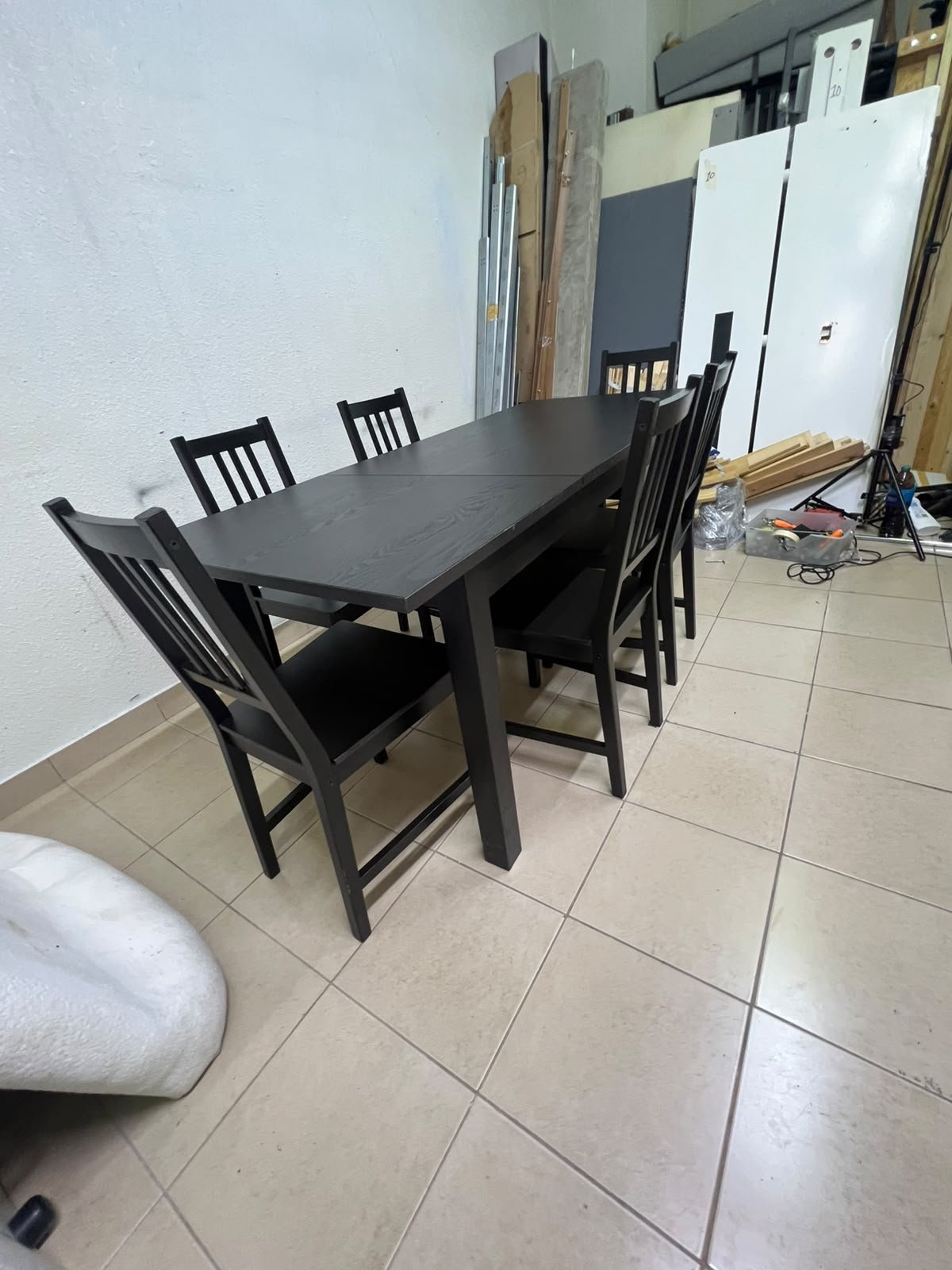A dark solid wood dining table with matching slat-back chairs, featuring the design of the "Nordviken" collection from IKEA. - Image 9