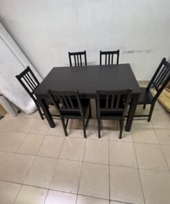 A dark solid wood dining table with matching slat-back chairs, featuring the design of the "Nordviken" collection from IKEA. - Image 12
