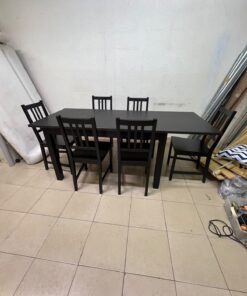 A dark solid wood dining table with matching slat-back chairs, featuring the design of the "Nordviken" collection from IKEA. - Image 13