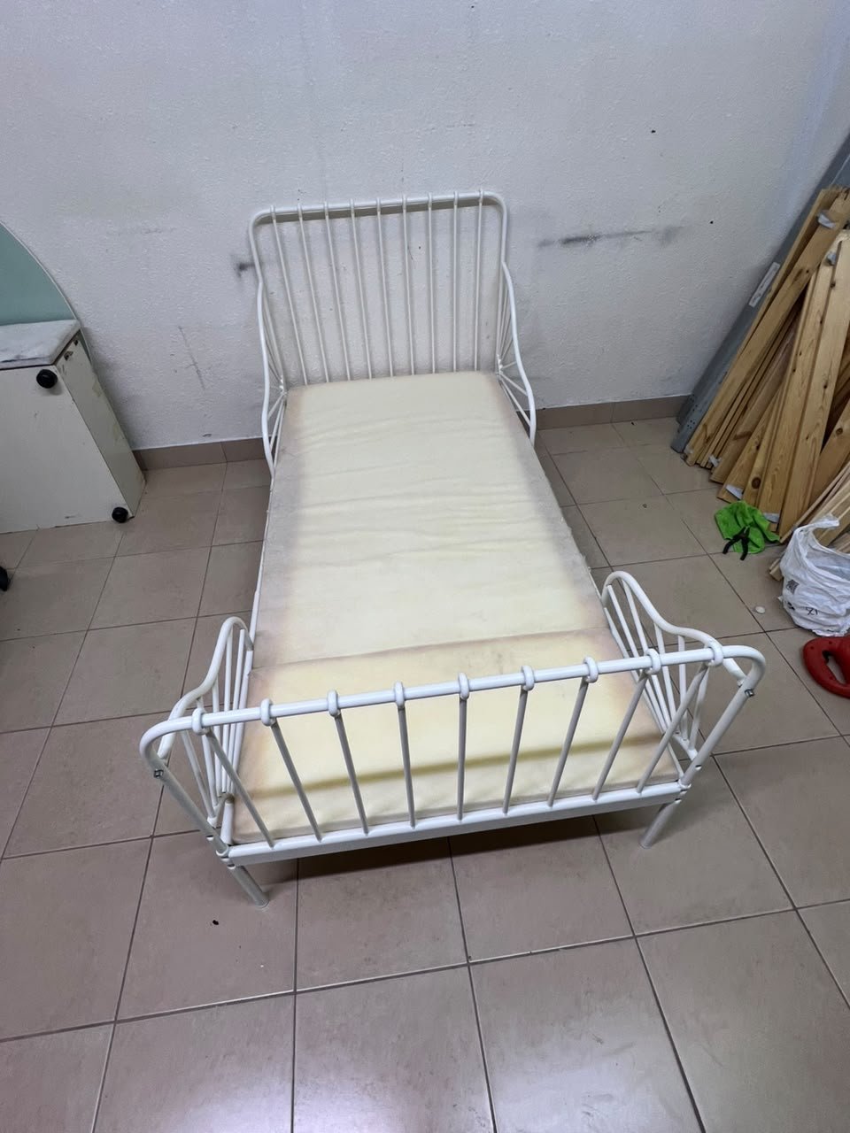The white extendable metal bed frame "MINNEN" from IKEA, featuring side rails with distinctive scrollwork details. - Image 4
