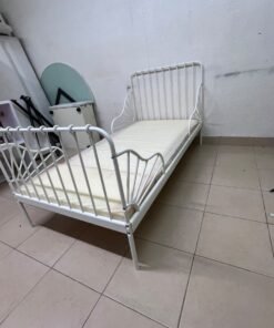 The white extendable metal bed frame "MINNEN" from IKEA, featuring side rails with distinctive scrollwork details. - Image 6