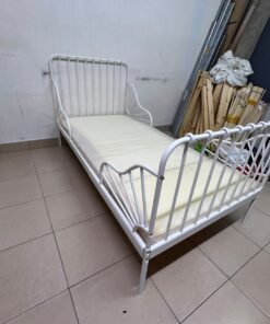 The white extendable metal bed frame "MINNEN" from IKEA, featuring side rails with distinctive scrollwork details. - Image 7
