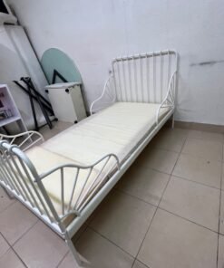The white extendable metal bed frame "MINNEN" from IKEA, featuring side rails with distinctive scrollwork details. - Image 8