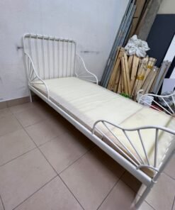 The white extendable metal bed frame "MINNEN" from IKEA, featuring side rails with distinctive scrollwork details. - Image 10