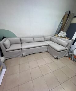 The L-shaped sectional sofa features a removable cover; it is the Crate & Barrel Belmar Modular Seating model, upholstered in a light gray, high-performance fabric with a linen-like texture, and includes comfortable back and arm cushions. - Image 2