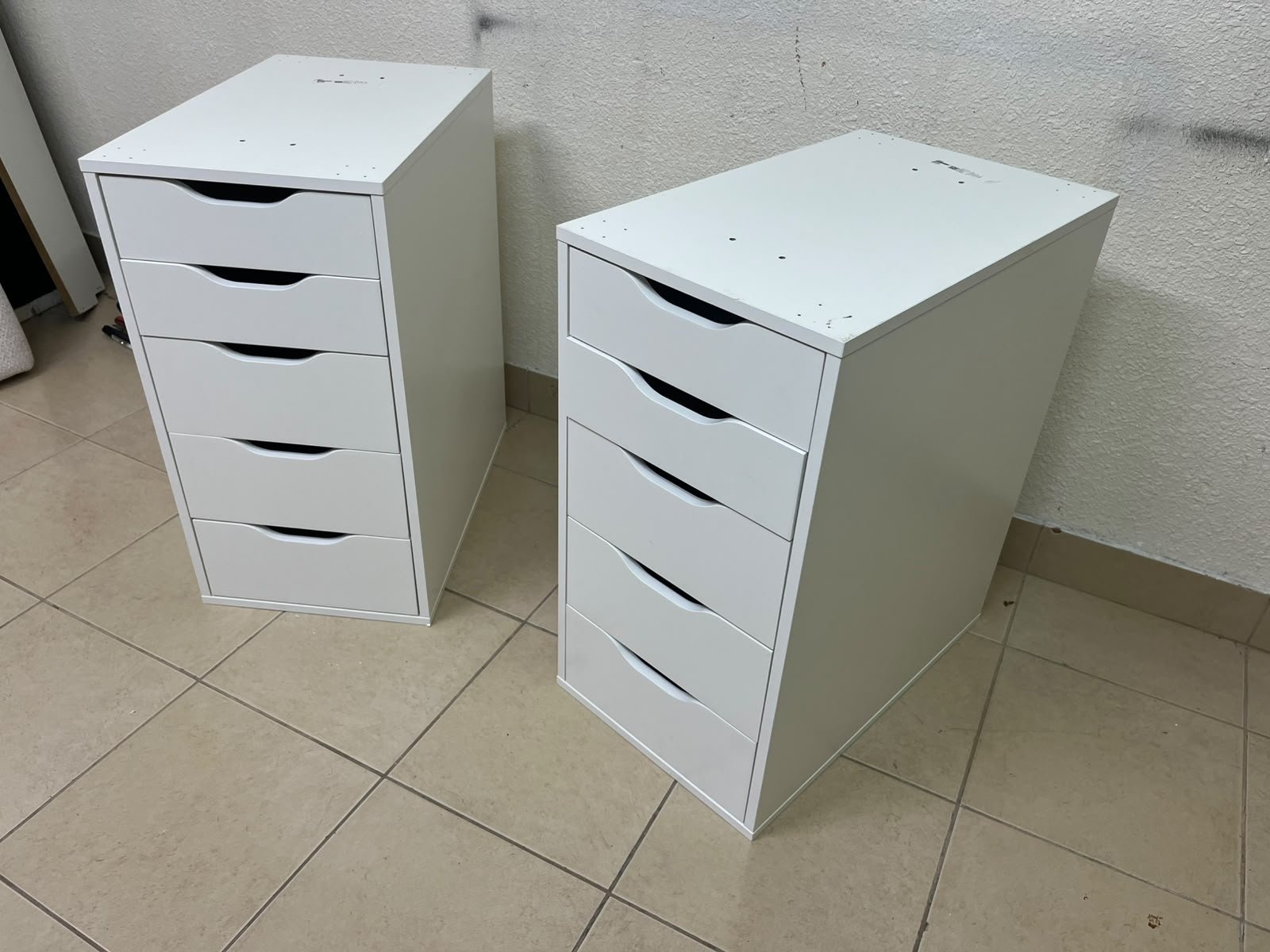 Two white IKEA ALEX drawer units (36x70 cm), featuring a practical and stylish design suitable for organizing items or serving as a desk base.