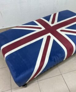 An Ottoman upholstered in luxurious velvet, featuring a vintage British flag design and metal stud detailing along the sides. - Image 8