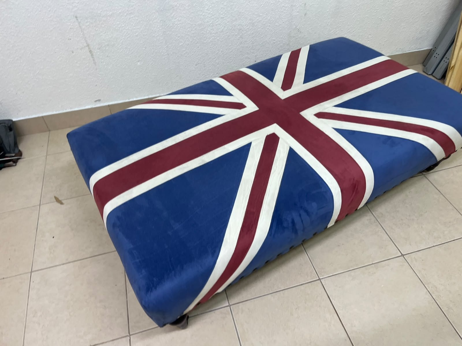 An Ottoman upholstered in luxurious velvet, featuring a vintage British flag design and metal stud detailing along the sides. - Image 8