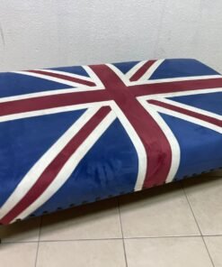 An Ottoman upholstered in luxurious velvet, featuring a vintage British flag design and metal stud detailing along the sides. - Image 7