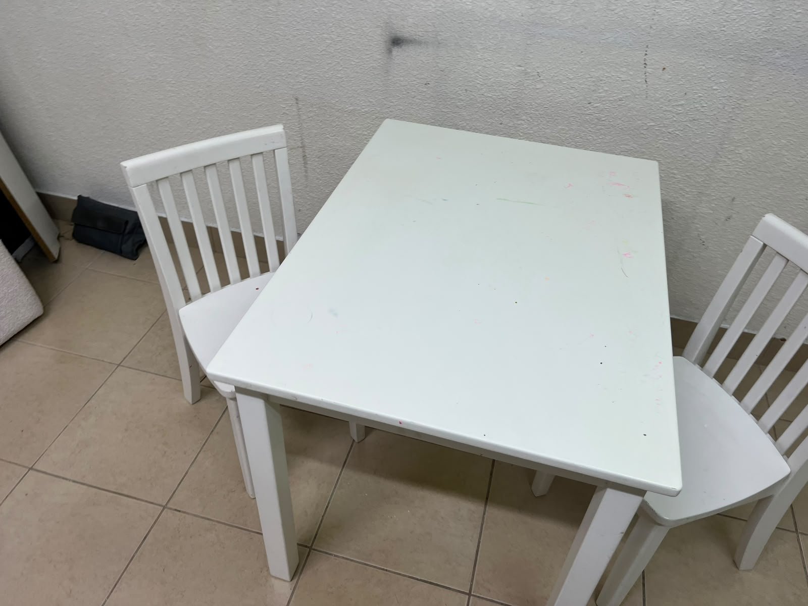 Home Centre children's table and two-chair set featuring a white wood design. - Image 6