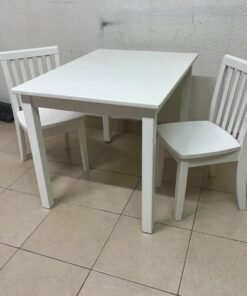 Home Centre children's table and two-chair set featuring a white wood design.