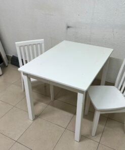 Home Centre children's table and two-chair set featuring a white wood design. - Image 2