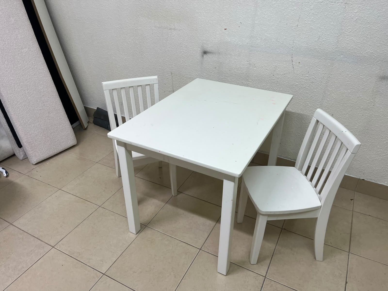 Home Centre children's table and two-chair set featuring a white wood design. - Image 2
