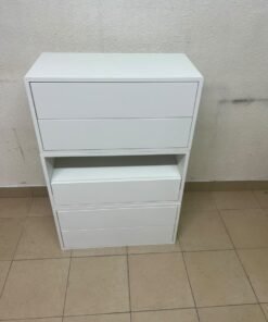 A white storage unit from IKEA’s EKET system, featuring a modular design that combines drawers with open storage space. - Image 2