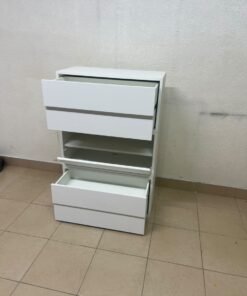 A white storage unit from IKEA’s EKET system, featuring a modular design that combines drawers with open storage space. - Image 3