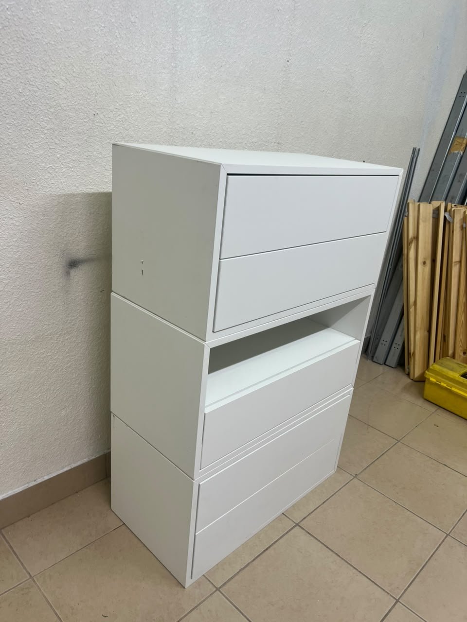 A white storage unit from IKEA’s EKET system, featuring a modular design that combines drawers with open storage space. - Image 4