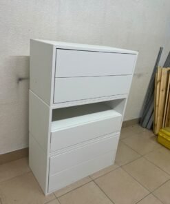 A white storage unit from IKEA’s EKET system, featuring a modular design that combines drawers with open storage space. - Image 9