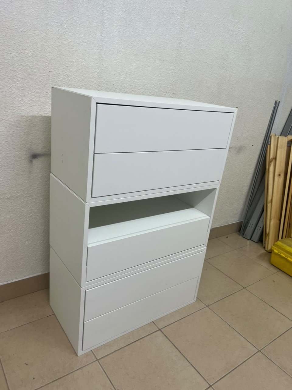 A white storage unit from IKEA’s EKET system, featuring a modular design that combines drawers with open storage space. - Image 9