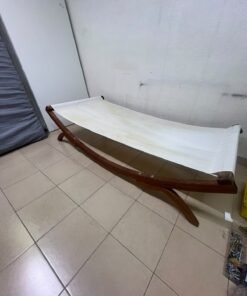 An elegantly designed, curved wooden hammock bed featuring comfortable white fabric for relaxation. - Image 7