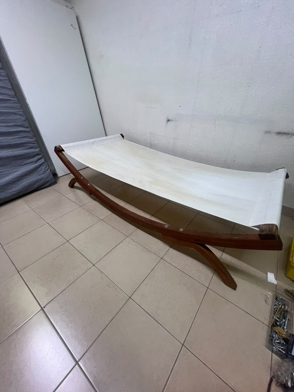 An elegantly designed, curved wooden hammock bed featuring comfortable white fabric for relaxation. - Image 7
