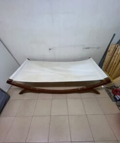 An elegantly designed, curved wooden hammock bed featuring comfortable white fabric for relaxation. - Image 8