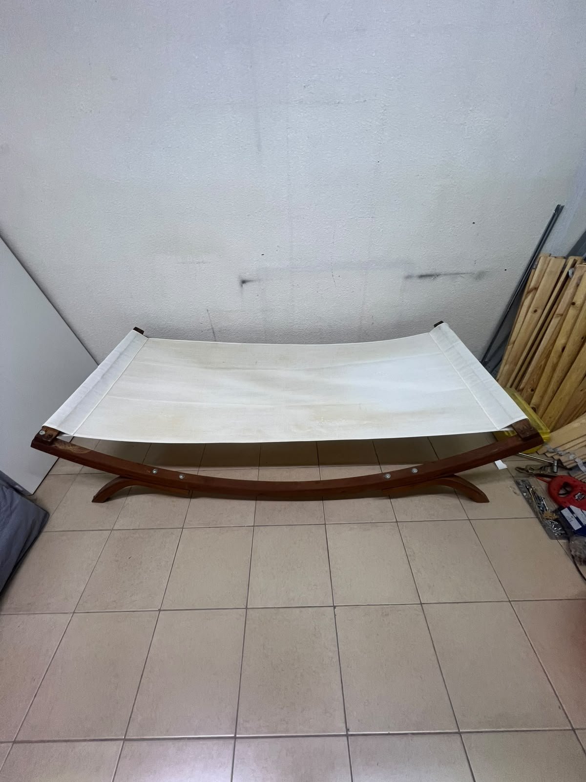 An elegantly designed, curved wooden hammock bed featuring comfortable white fabric for relaxation. - Image 8
