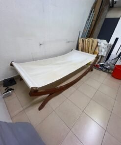 An elegantly designed, curved wooden hammock bed featuring comfortable white fabric for relaxation. - Image 3