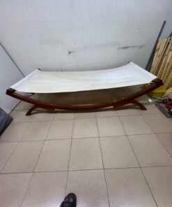 An elegantly designed, curved wooden hammock bed featuring comfortable white fabric for relaxation. - Image 6