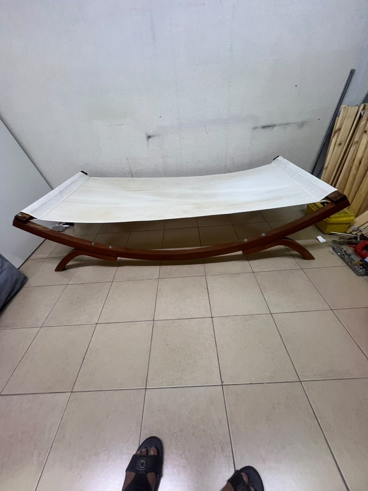 An elegantly designed, curved wooden hammock bed featuring comfortable white fabric for relaxation. - Image 6