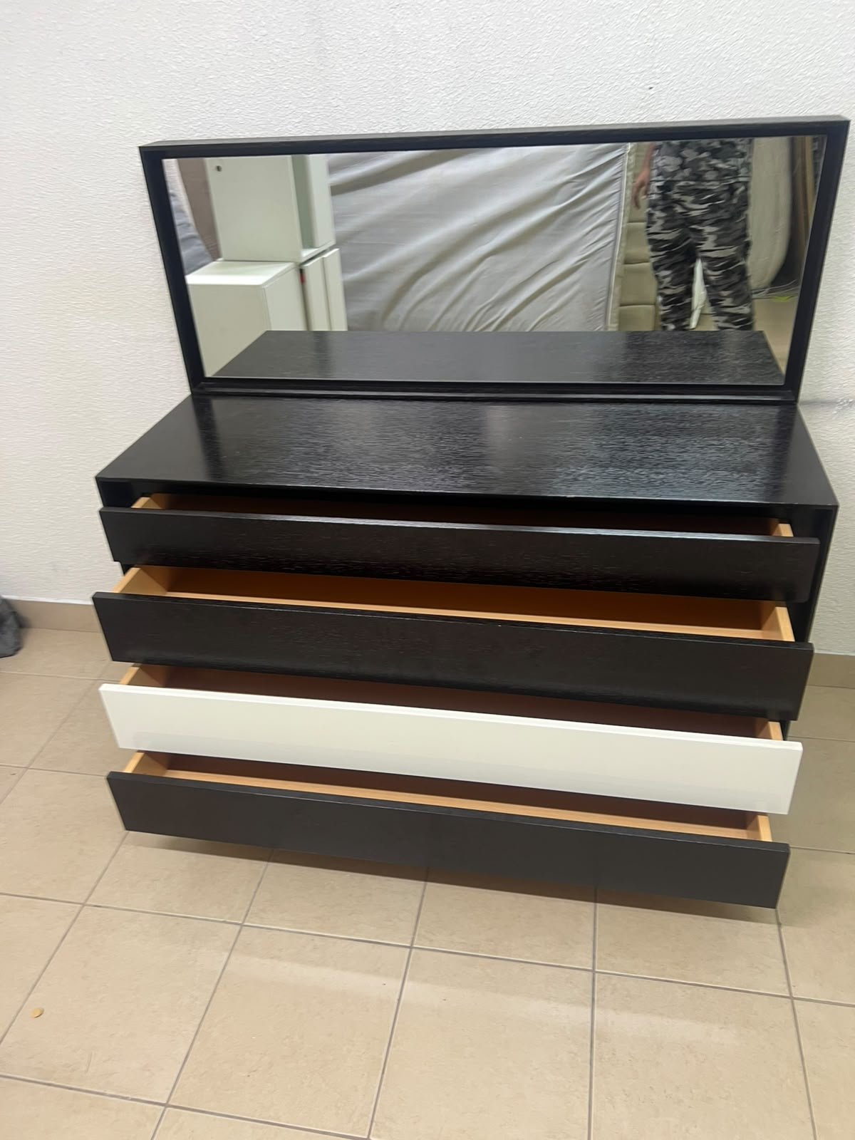 A dark brown wooden dresser featuring a wide white central drawer, accompanied by a large mirror with a matching rectangular frame. - Image 2