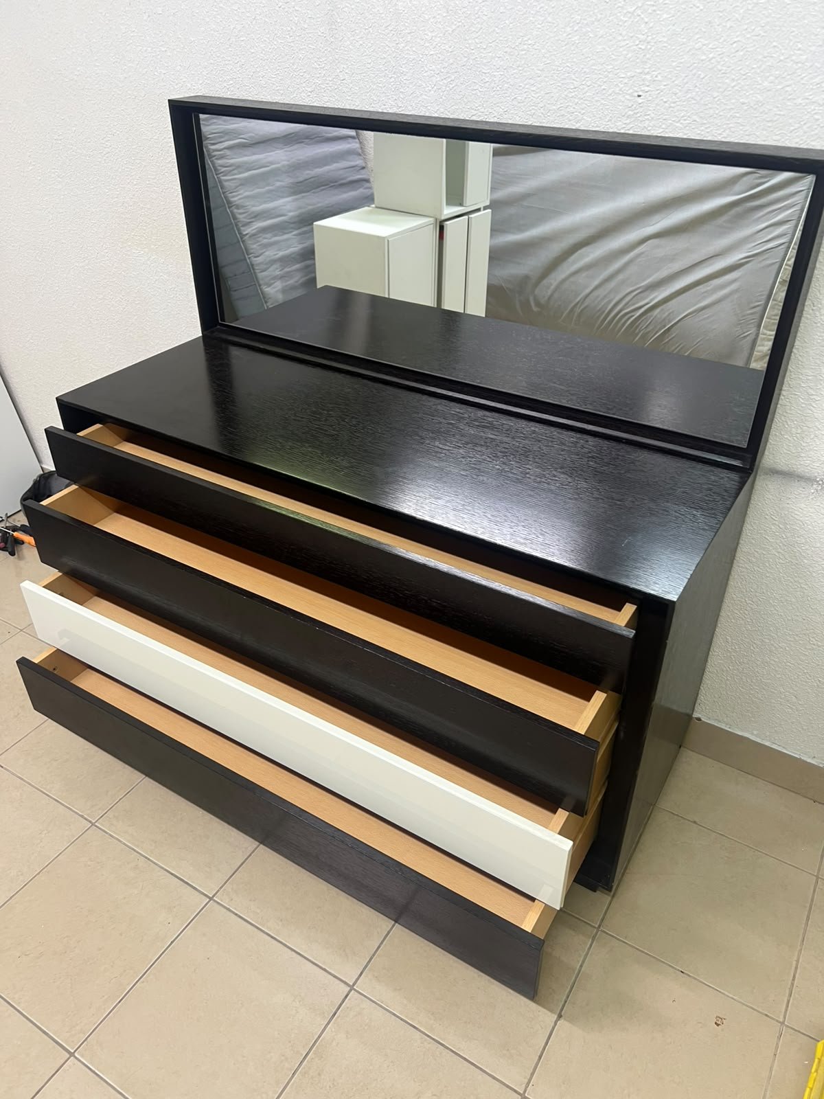 A dark brown wooden dresser featuring a wide white central drawer, accompanied by a large mirror with a matching rectangular frame. - Image 9