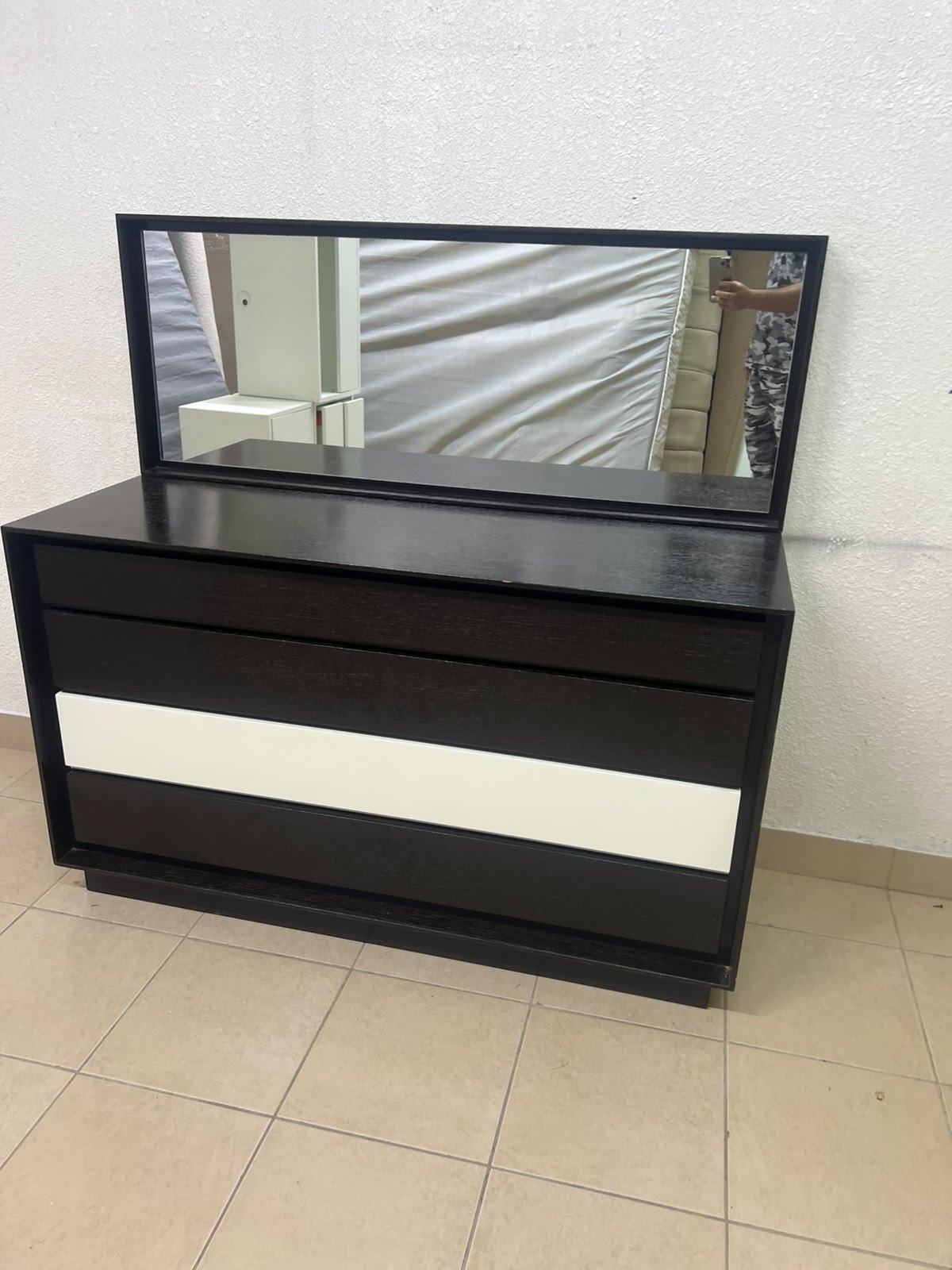 A dark brown wooden dresser featuring a wide white central drawer, accompanied by a large mirror with a matching rectangular frame. - Image 10