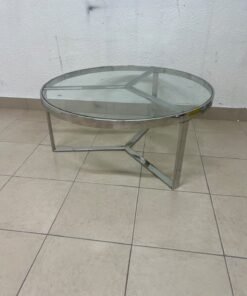 A round coffee table featuring a silver-colored metal frame (steel or chrome), a clear glass top, and a geometric crisscross base design. - Image 3