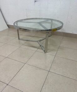 A round coffee table featuring a silver-colored metal frame (steel or chrome), a clear glass top, and a geometric crisscross base design. - Image 9