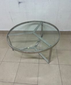 A round coffee table featuring a silver-colored metal frame (steel or chrome), a clear glass top, and a geometric crisscross base design. - Image 8