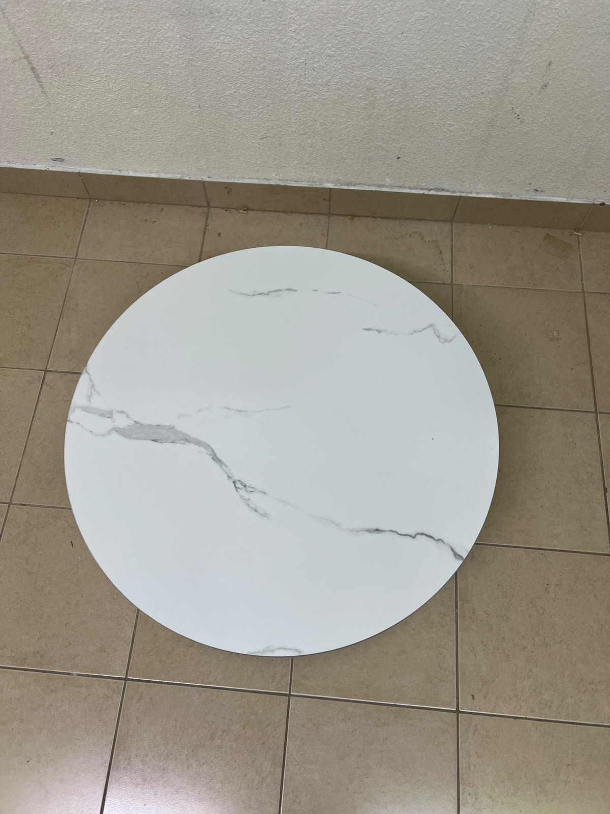 This round coffee table is elegant, featuring a cream-colored ribbed base and a stone tabletop with a marble-like pattern. - Image 6