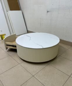 This round coffee table is elegant, featuring a cream-colored ribbed base and a stone tabletop with a marble-like pattern. - Image 7