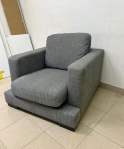 This is a single-seater chair (armchair) featuring a modern design, upholstered in gray fabric, with wide, square armrests. - Image 3