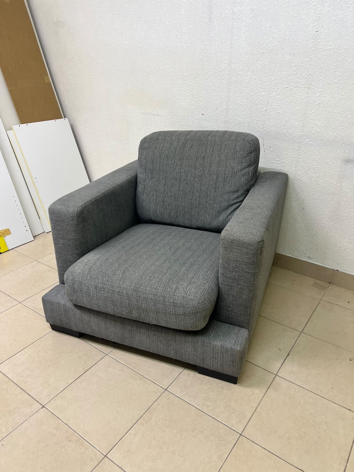 This is a single-seater chair (armchair) featuring a modern design, upholstered in gray fabric, with wide, square armrests. - Image 4