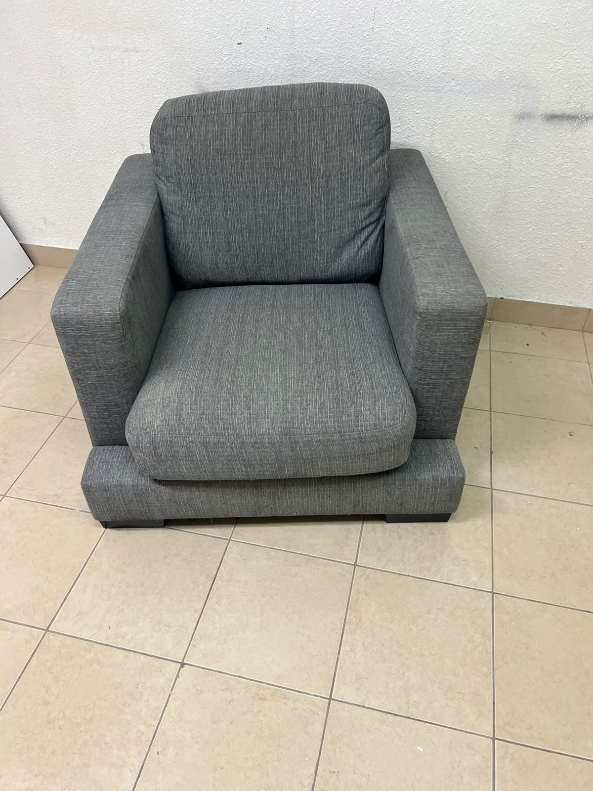 This is a single-seater chair (armchair) featuring a modern design, upholstered in gray fabric, with wide, square armrests. - Image 5