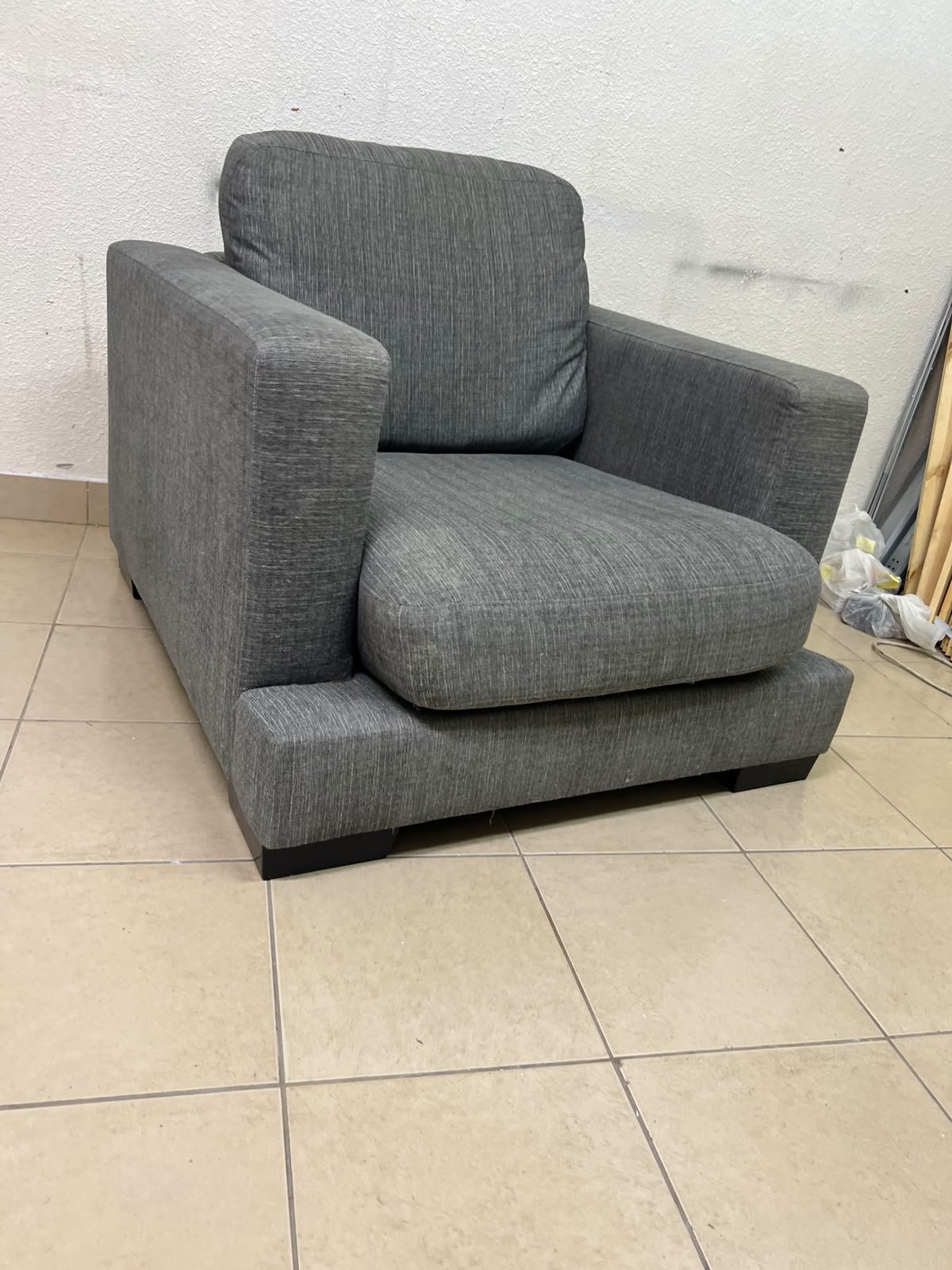 This is a single-seater chair (armchair) featuring a modern design, upholstered in gray fabric, with wide, square armrests. - Image 6