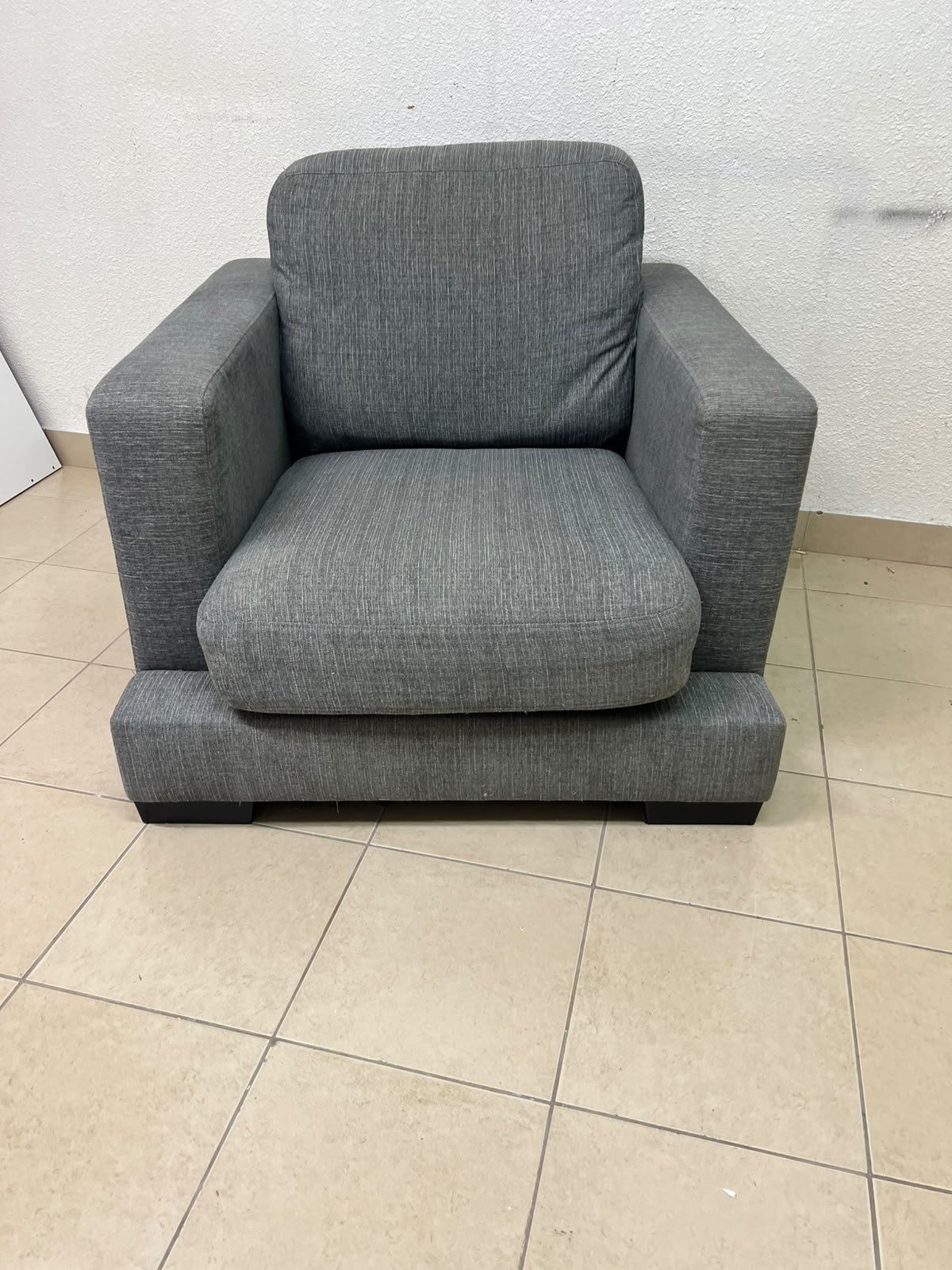 This is a single-seater chair (armchair) featuring a modern design, upholstered in gray fabric, with wide, square armrests. - Image 8