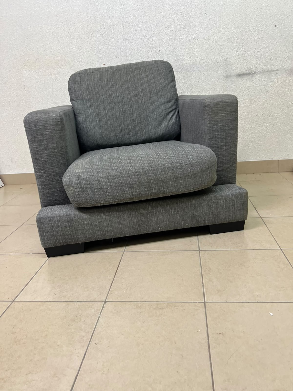 This is a single-seater chair (armchair) featuring a modern design, upholstered in gray fabric, with wide, square armrests. - Image 9