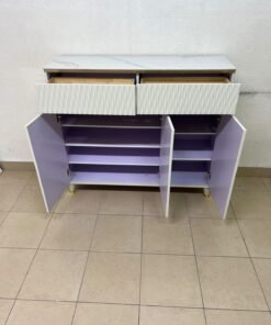 A white shoe cabinet or entryway storage unit (console) featuring a modern design, ribbed upper drawers, and gold accents on the handles and legs. - Image 6