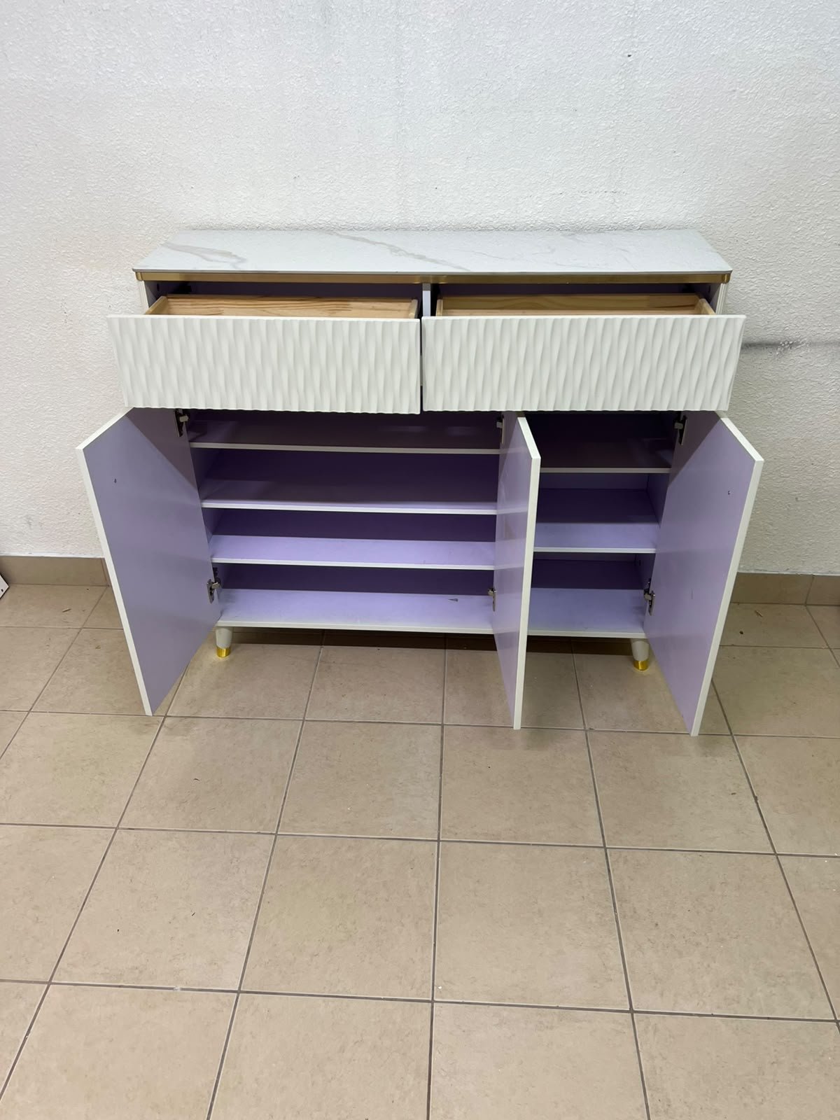 A white shoe cabinet or entryway storage unit (console) featuring a modern design, ribbed upper drawers, and gold accents on the handles and legs. - Image 6