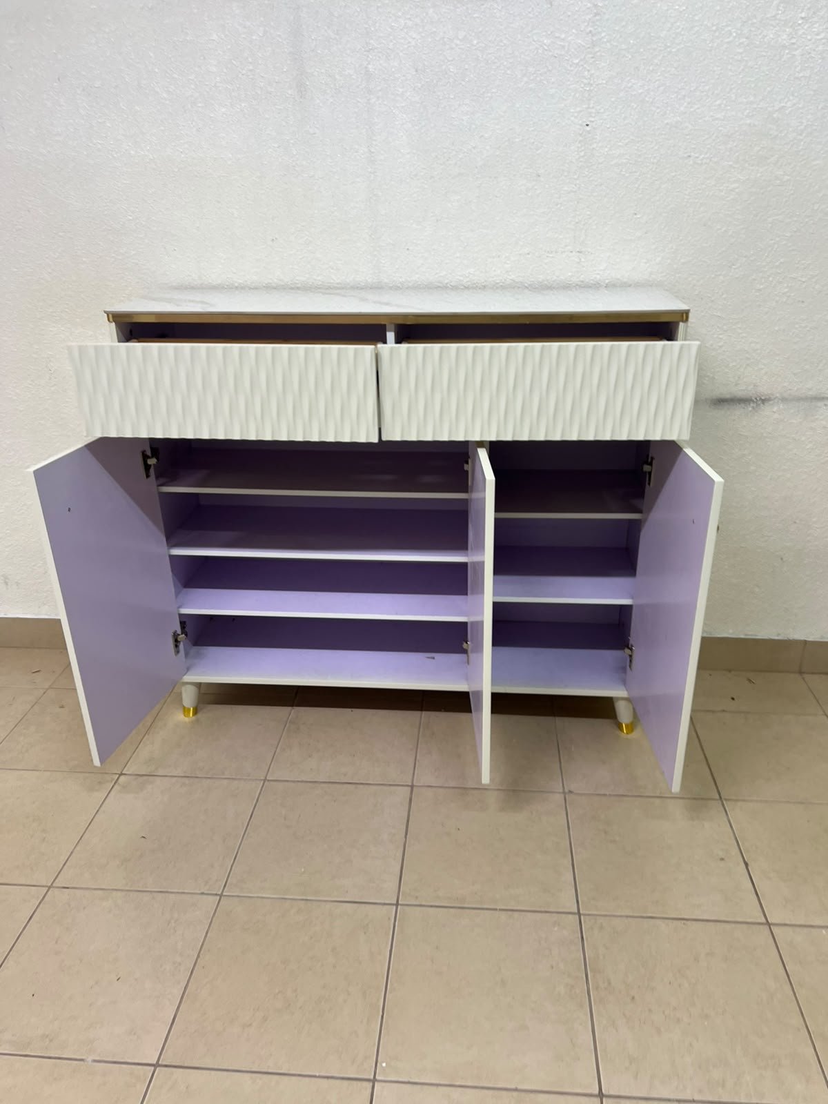 A white shoe cabinet or entryway storage unit (console) featuring a modern design, ribbed upper drawers, and gold accents on the handles and legs. - Image 4