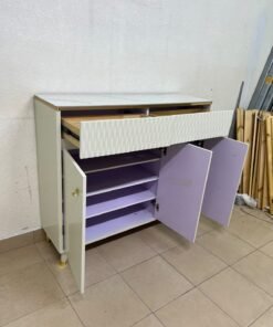 A white shoe cabinet or entryway storage unit (console) featuring a modern design, ribbed upper drawers, and gold accents on the handles and legs. - Image 5