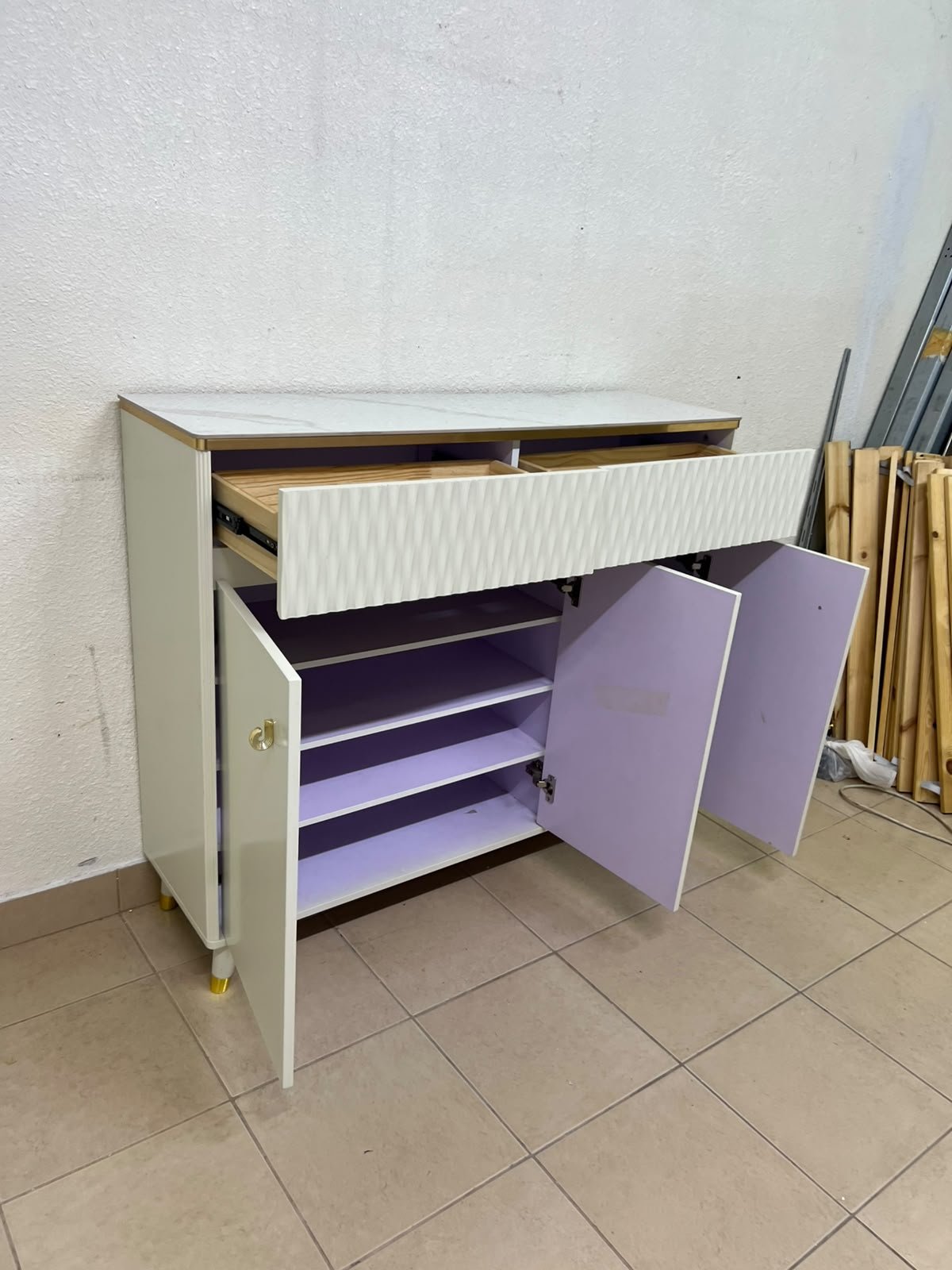 A white shoe cabinet or entryway storage unit (console) featuring a modern design, ribbed upper drawers, and gold accents on the handles and legs. - Image 5